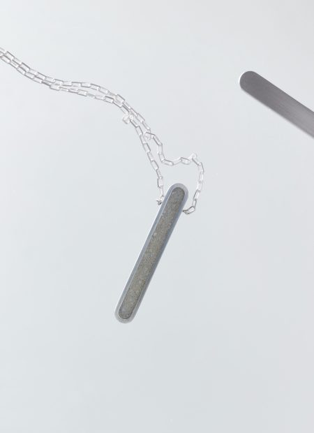 Arcil necklace – handcrafted concrete and silver minimalist architectural jewelry.