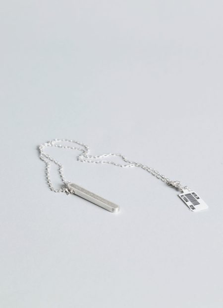 Arcil necklace – handcrafted concrete and silver minimalist architectural jewelry.