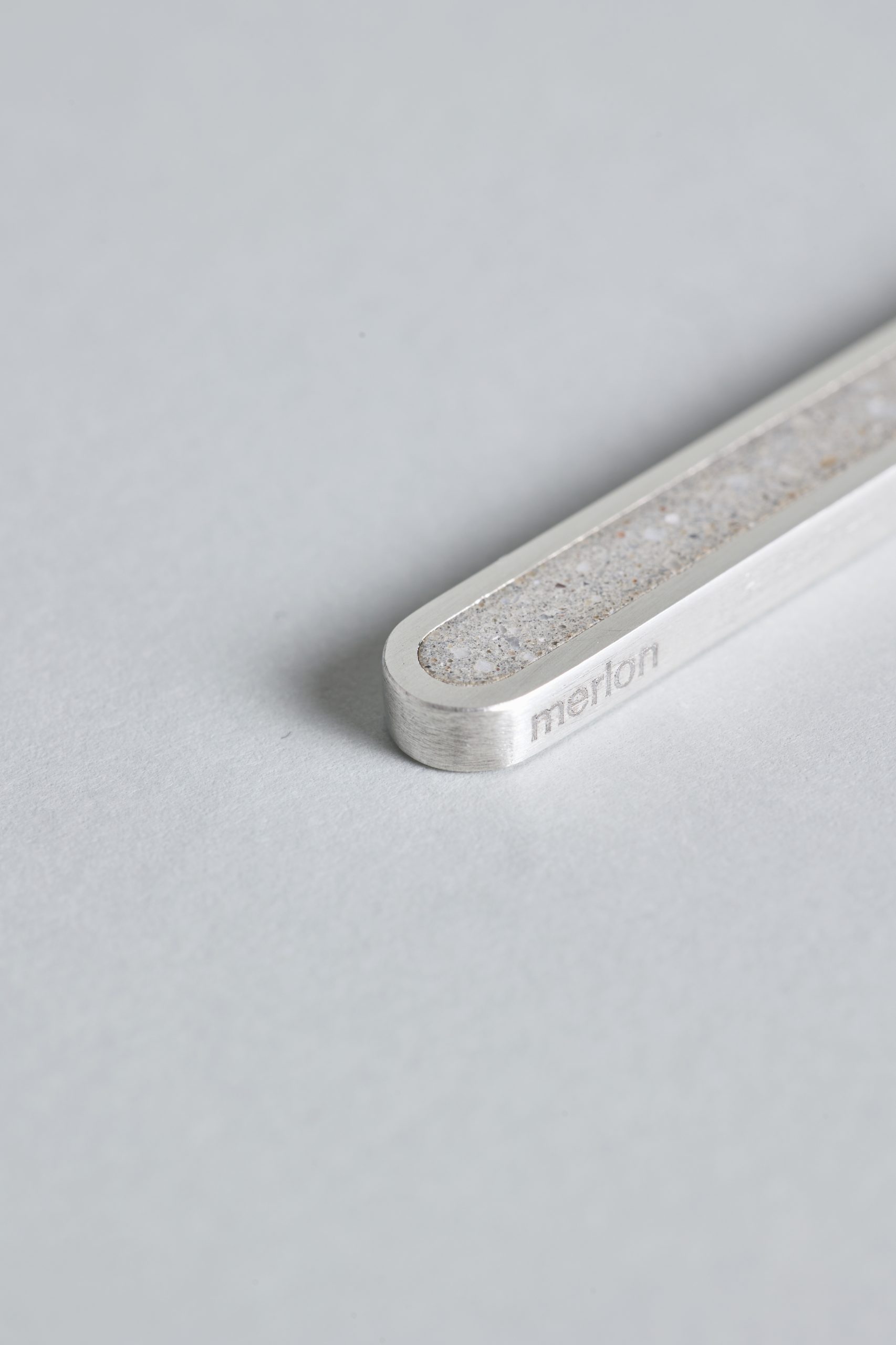 Arcil necklace – handcrafted concrete and silver minimalist architectural jewelry.