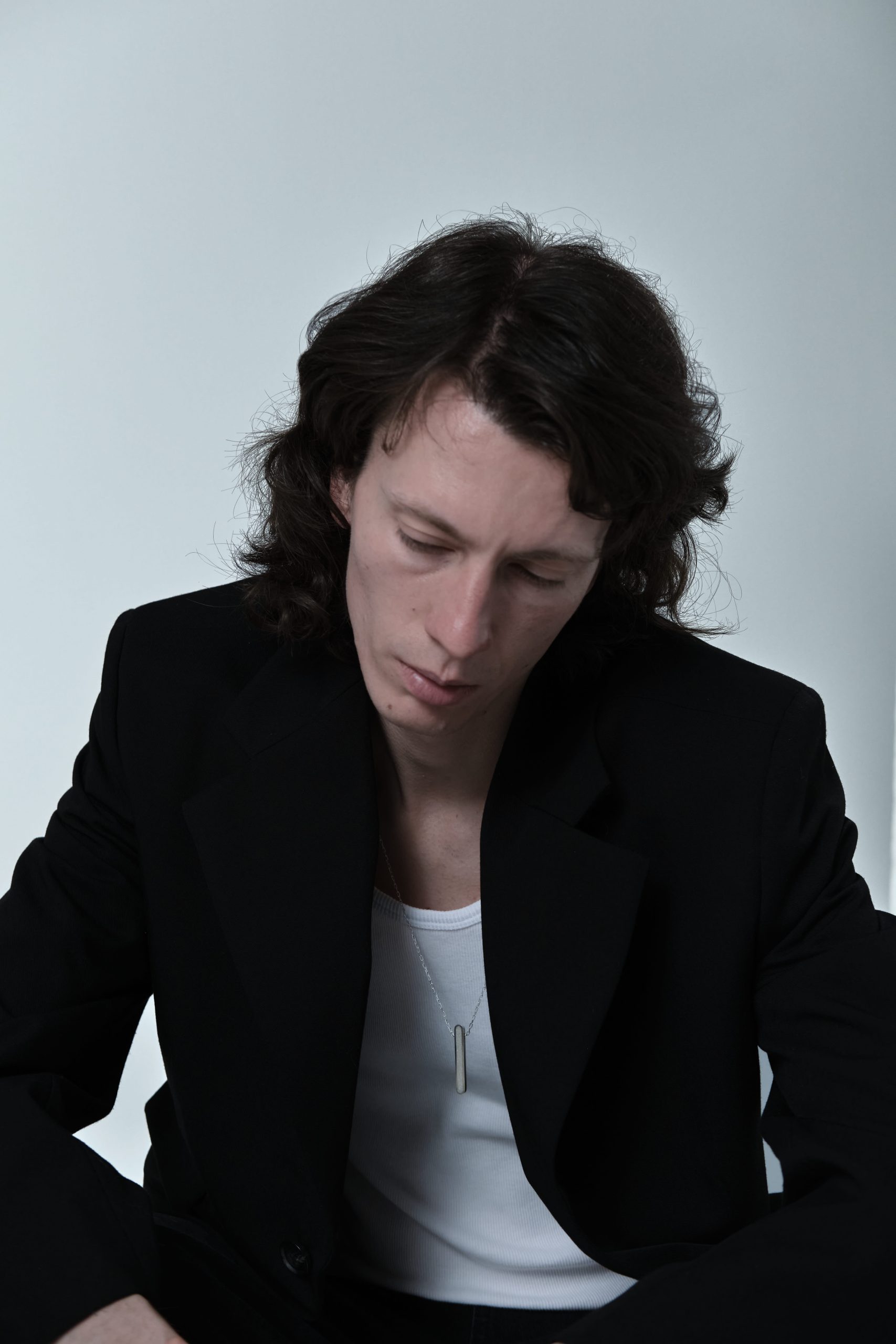 Arcil necklace – handcrafted concrete and silver minimalist architectural jewelry.