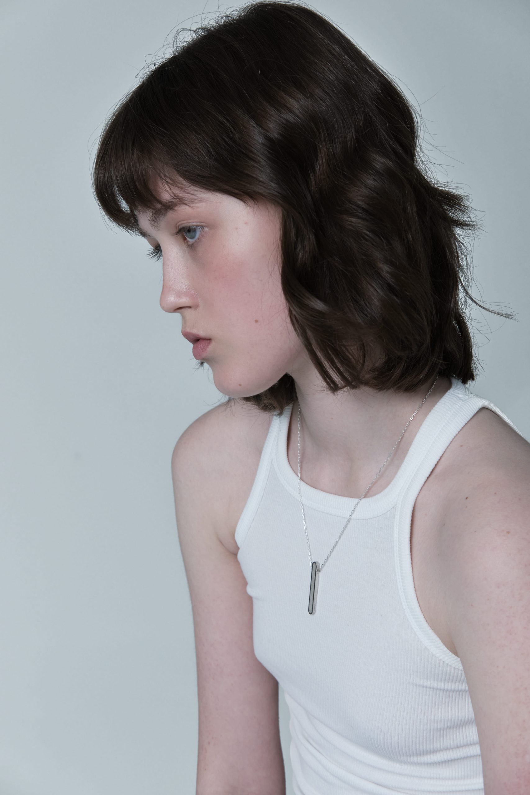 Arcil necklace – handcrafted concrete and silver minimalist architectural jewelry.