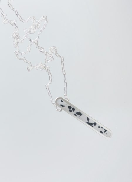 Arcil necklace – handcrafted concrete and silver minimalist architectural jewelry.