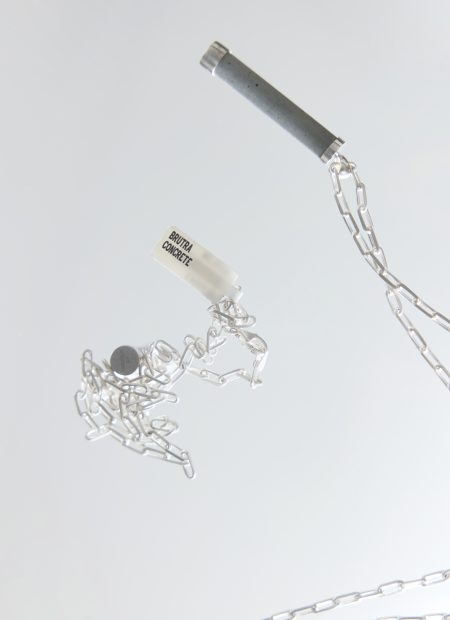 Brutra necklace – handcrafted concrete and silver minimalist architectural jewelry.