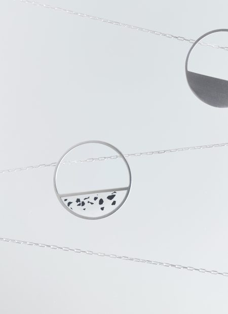 Hurne necklace – handcrafted concrete and silver minimalist architectural jewelry.