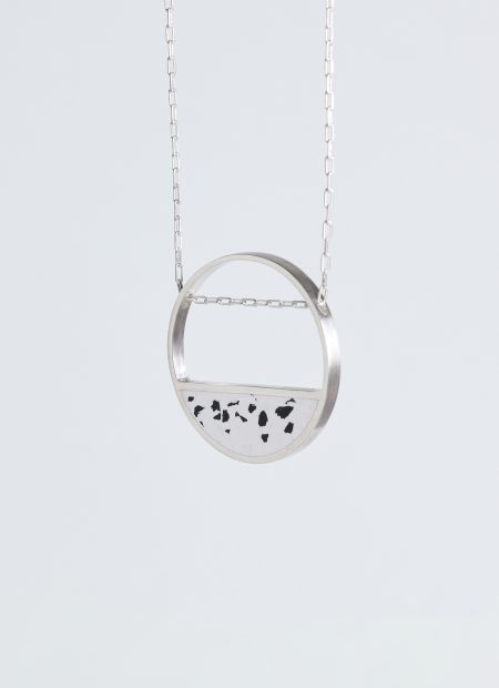 Hurne necklace – handcrafted concrete and silver minimalist architectural jewelry.