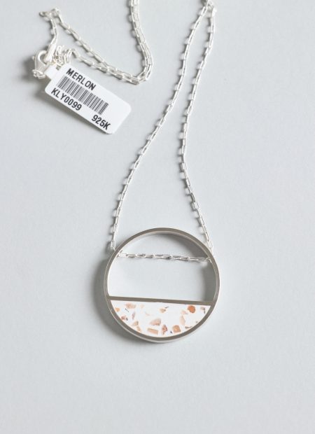 Hurne necklace – handcrafted concrete and silver minimalist architectural jewelry.