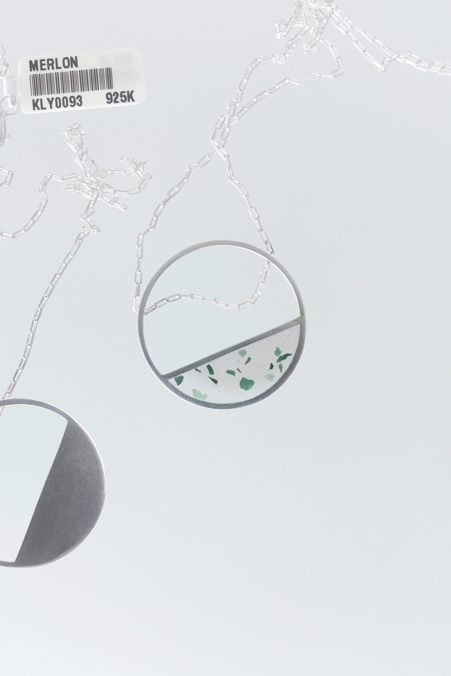 Hurne necklace – handcrafted concrete and silver minimalist architectural jewelry.