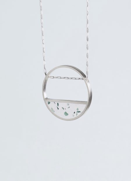 Hurne necklace – handcrafted concrete and silver minimalist architectural jewelry.
