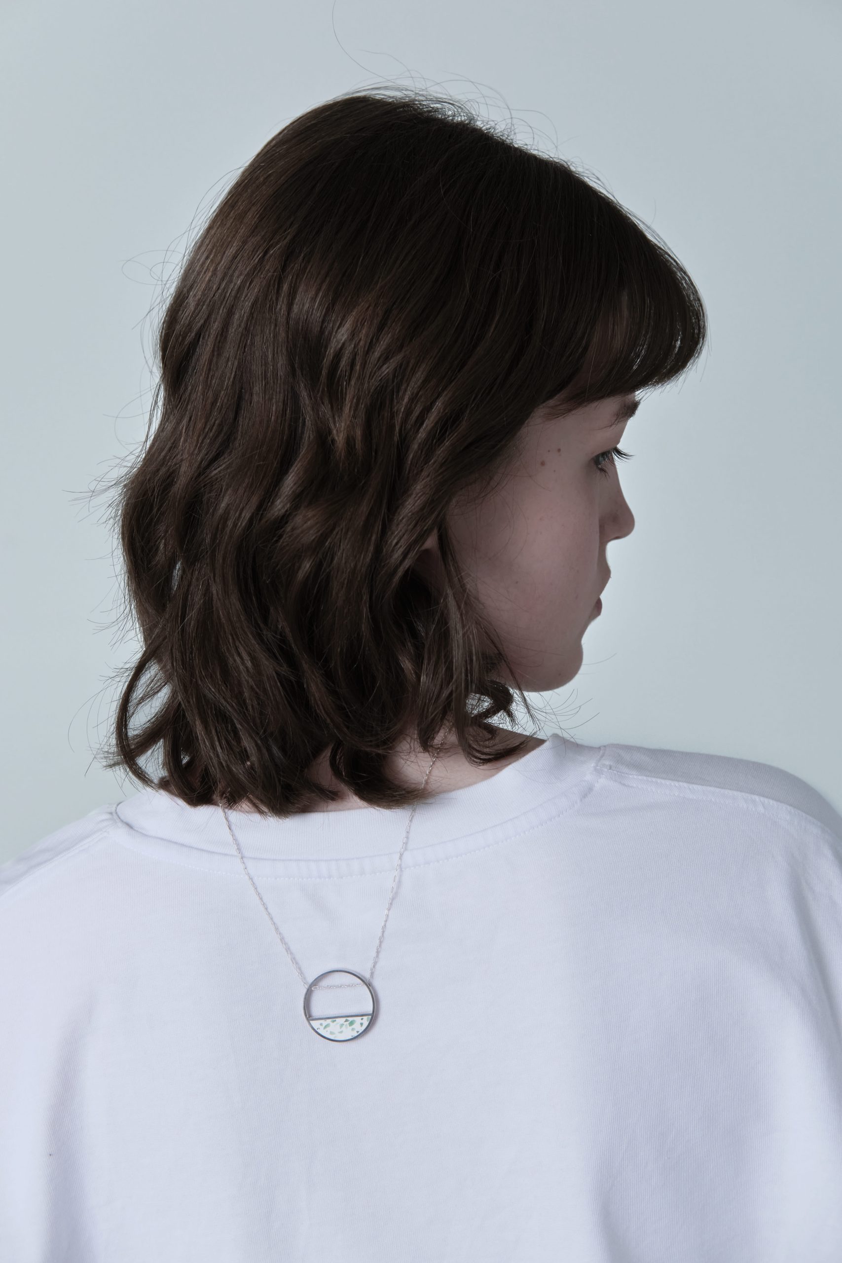 Hurne necklace – handcrafted concrete and silver minimalist architectural jewelry.