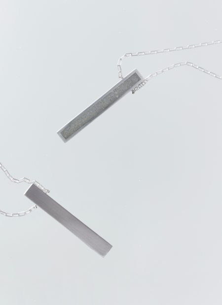 Lintour necklace – handcrafted concrete and silver minimalist architectural jewelry.