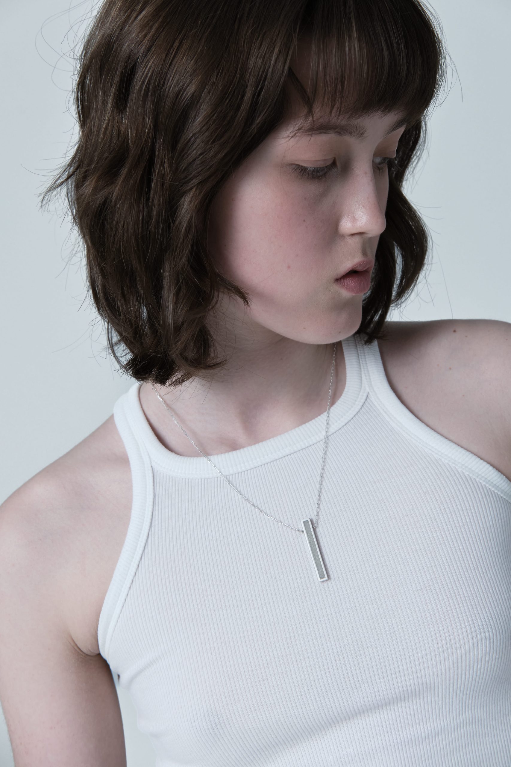 Lintour necklace – handcrafted concrete and silver minimalist architectural jewelry.