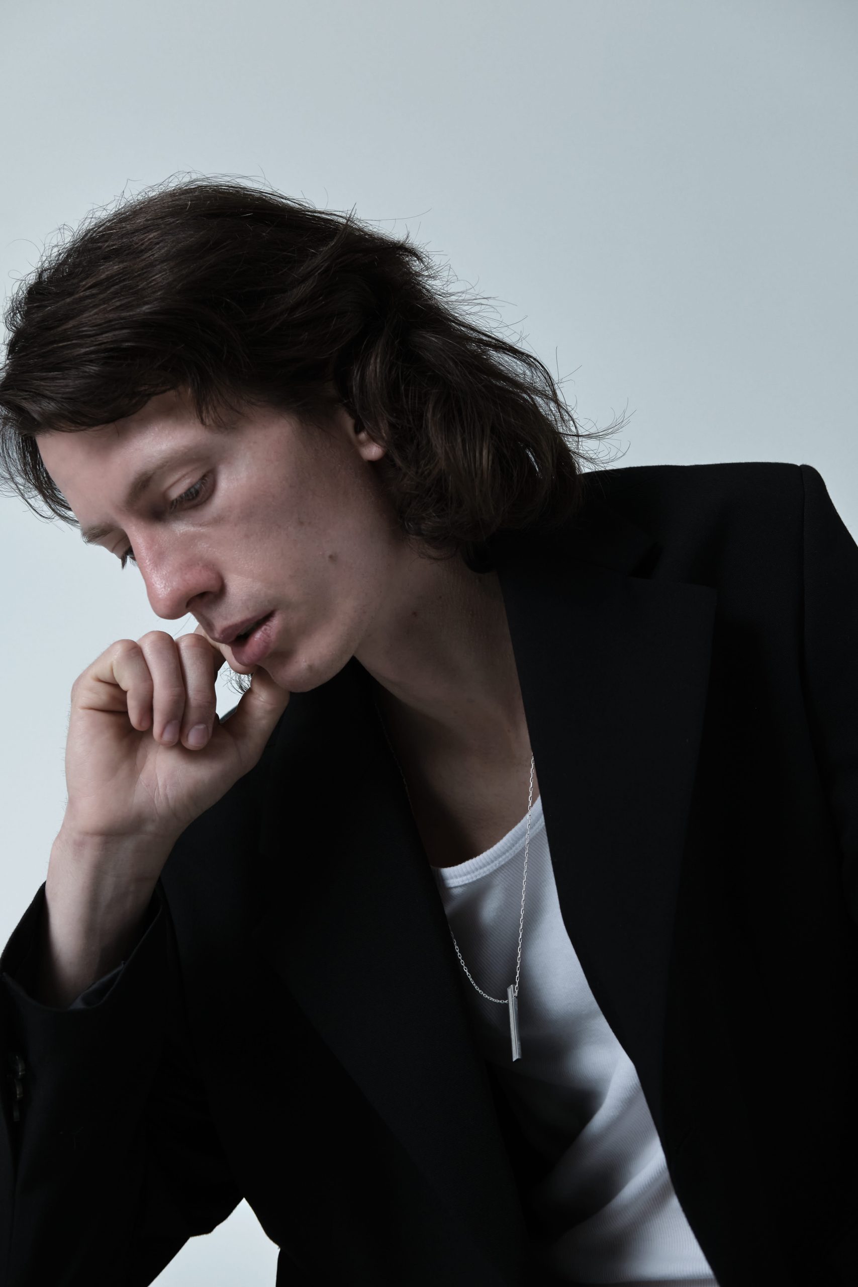 Lintour necklace – handcrafted concrete and silver minimalist architectural jewelry.