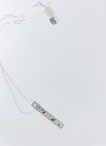 Lintour necklace – handcrafted concrete and silver minimalist architectural jewelry.