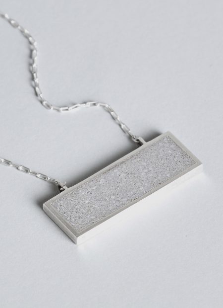 Panvell necklace – handcrafted concrete and silver minimalist architectural jewelry.