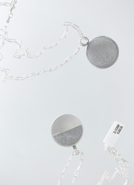 Revorta necklace – handcrafted concrete and silver minimalist architectural jewelry.
