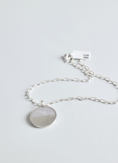 Revorta necklace – handcrafted concrete and silver minimalist architectural jewelry.