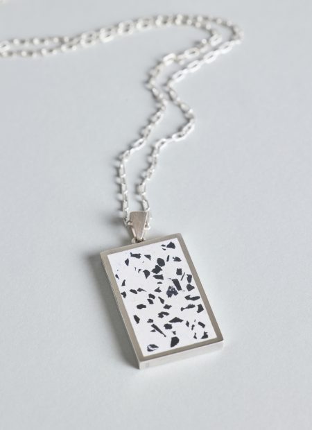 Solmant necklace – handcrafted concrete and silver minimalist architectural jewelry.