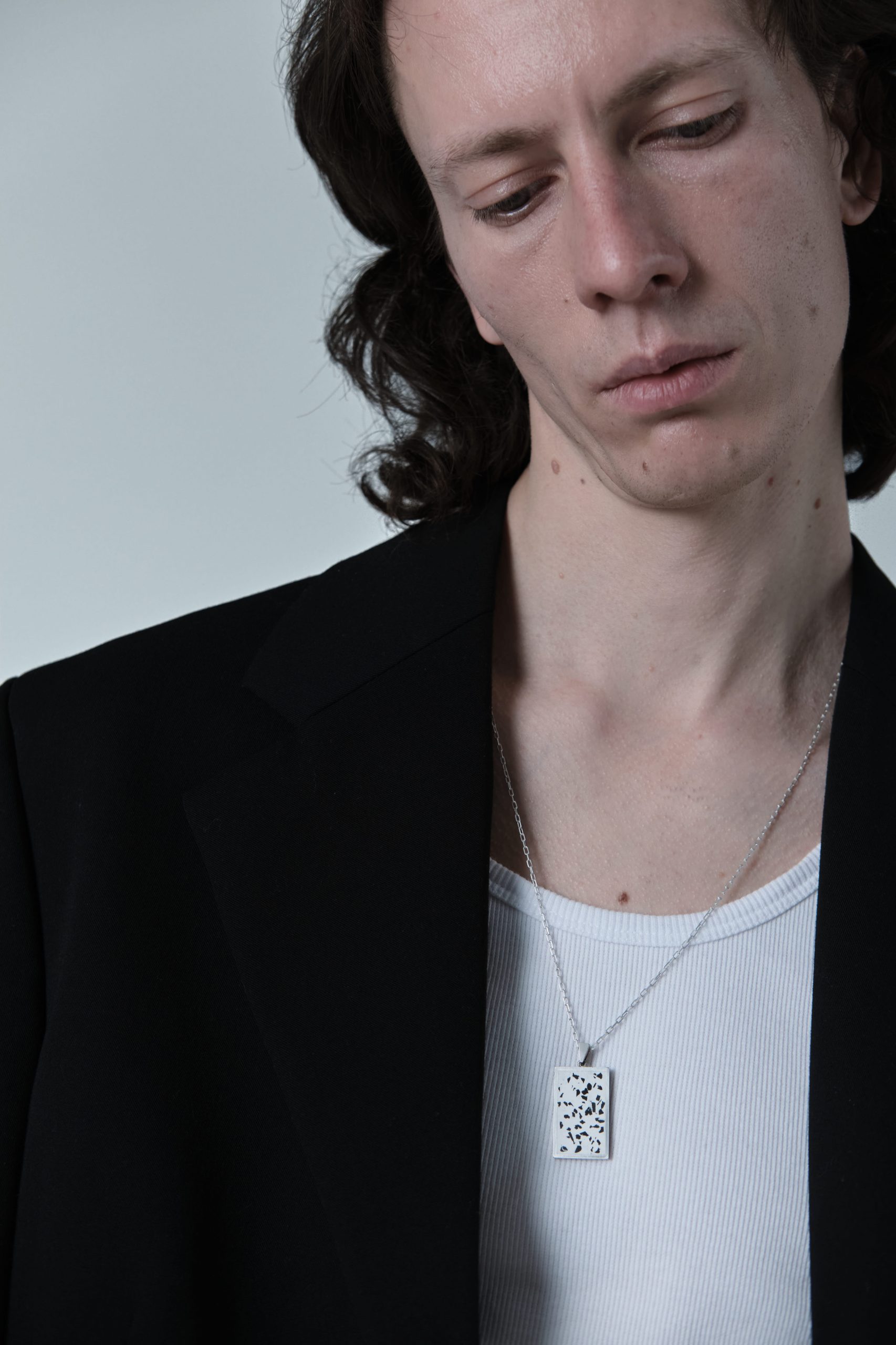 Solmant necklace – handcrafted concrete and silver minimalist architectural jewelry.