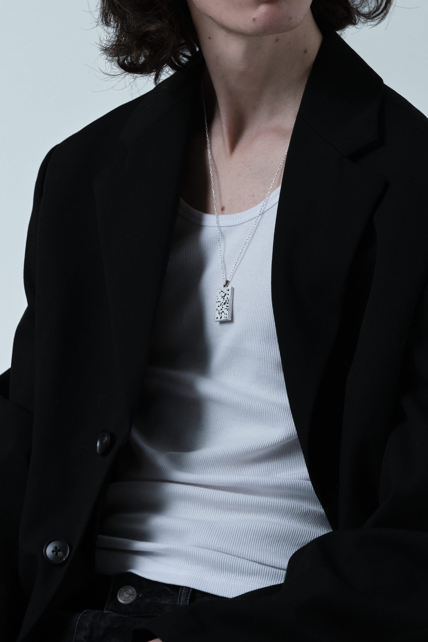 Solmant necklace – handcrafted concrete and silver minimalist architectural jewelry.