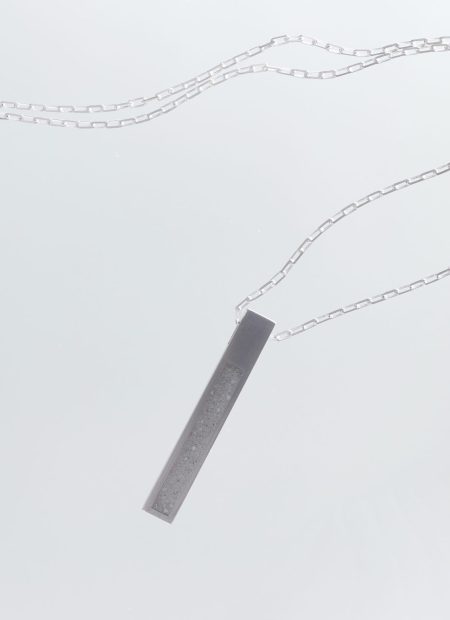 Strund necklace – handcrafted concrete and silver minimalist architectural jewelry.